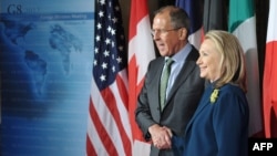 U.S. Secretary of State Hillary Clinton (right) poses with Russian Foreign Minister Sergei Lavrov during the G8 foreign ministers meeting at Blair House in Washington, D.C., on April 11.