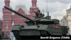 A T-80BVM tank moves during a rehearsal for the Victory Day military parade on Red Square in Moscow in May 2021.