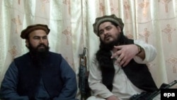 Hakimullah Mehsud (right), chief of Tehrik-e Taliban Pakistan (Pakistani Taliban movement), in an undated video recorded at an undisclosed location near the Pakistani-Afghan border.