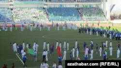 "When the president appears in the stadium, everyone will stand up and say the following, 'My beloved country Turkmenistan and glory to the Protector.' Let's practice it!" 