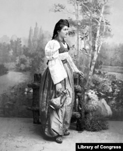 A Bosnian woman poses in traditional clothing in the 1890s.