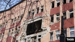 A hole in the facade of the hospital after the blast