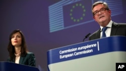 EU Commissioner for Security Union Julian King (right) talks to journalists during a joint news conference with Commissioner for Digital Economy Mariya Gabriel in Brussels on January 29.