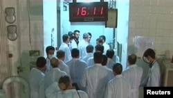 A group of Iranian scientists near the control room area at the Tehran Research Reactor in a February 15 photo.