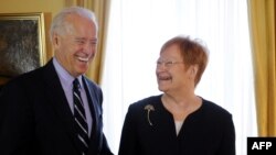 U.S. Vice President Joe Biden shares a laugh with Finnish President Tarja Halonen at the Presidential Palace in Helsinki.