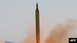 Iran tests a long-range Shahab-3 missile at an unspecified location in September 2009.