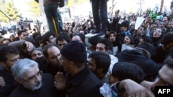 Iranian opposition leader Mir Hossein Musavi (left) attends the funeral procession of Grand Ayatollah Hossein Ali Montazeri in the holy city of Qom.