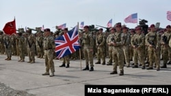 Troops prepare for military maneuvers in the republic of Georgia on July 30.