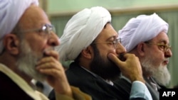 Ayatollah Mohammad Mohammadi Gilani (right) attends a meeting of the Assembly of Experts during the opening session of its annual assembly in Tehran in September 2002.