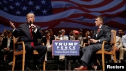 Then-Republican presidential nominee Donald Trump (left) speaks alongside Michael Flynn during a campaign stop in Virginia Beach, Virginia, on September 6, 2016,