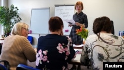 Russian speakers attend a Latvian language class in Riga in May 2023.