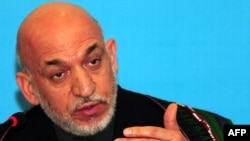 Afghan President Hamid Karzai speaks to the media at a press conference in Istanbul.