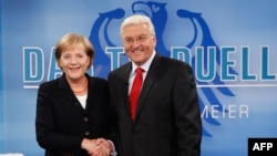 German Chancellor Angela Merkel (CDU) and Social Democratic Party (SPD) leader and Foreign Minister Frank-Walter Steinmeier prior to the fourth-ever televised German election debate, in Berlin on September 13.