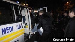 Injured concertgoers are transported for medical attention after the October 14 explosion in Chisinau.