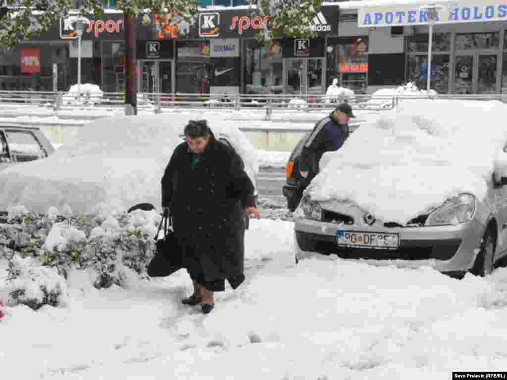 Residents of Montenegro&#39;s capital, Podgorica, dig out after a recent snowfall. The northern parts of the country saw temperatures of -22 Celsius on February 2.