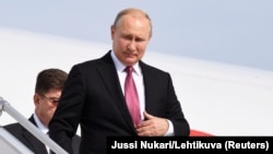 Russian President Vladimir Putin arrives at Helsinki's airport on August 21.