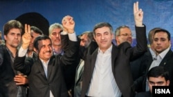 Iranian president Mahmud Ahmadinejad (center left) accompanied his close adviser Esfandiar Rahim Mashaei as he registered for the upcoming presidential election. 