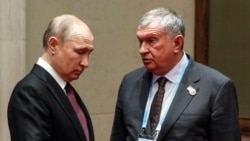 Russian President Vladimir Putin (left) with Rosneft CEO Igor Sechin (file photo)