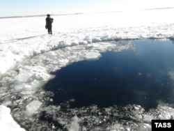 Russia's Emergency Situations Ministry released this photo of a hole in the ice atop a lake in the Chelyabinsk region thought to have been caused by a meteorite from the February 15 incident.