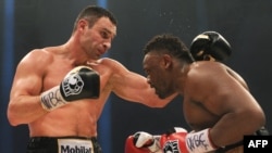 Vitaliy Klitschko sizes up British opponent Dereck Chisora in a defense of his WBC World Heavyweight Championship title in Munich in February.