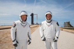 NASA astronauts Douglas Hurley (left) and Robert Behnken at a dress rehearsal for launch at the Kennedy Space Center on May 23.