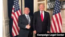 Ukrainian-American businessman Lev Parnas (left) is seen in a 2018 social-media post appearing to show him at the White House with President Donald Trump in a screen capture from his social media account made in 2018 by the Campaign Legal Center.