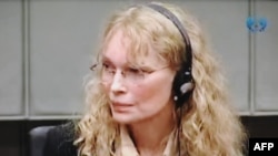 Mia Farrow testifies before a war crimes trial in The Hague in 2010.