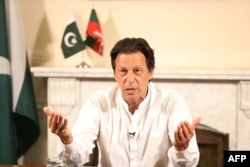 Imran Khan addresses the nation at his residence in Islamabad the day after general elections. His foreign policy views have raised eyebrows.