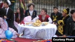 Young Kazakhs in traditional costumes mark the National Day of Lovers, also known as Kozy Korpesh and Bayan-Sulu day, in 2012.