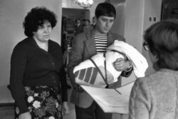 A registration ceremony for a newborn baby in October 1983