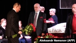 Russian President Vladimir Putin pays his last respects to Lyudmila Alekseyeva at her farewell ceremony in Moscow.