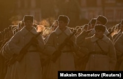 Russian Army soldiers dressed in historical uniforms take part in a rehearsal for a military parade to mark the anniversary of Soviet soldiers leaving for the front in 1941 during World War II.