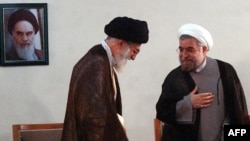 Supreme leader Ayatollah Ali Khamenei (left) meets with President-elect Hassan Rohani in Tehran on June 16.