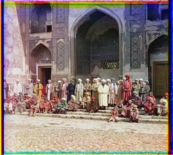 Men pose outside an Islamic school in Samarkand.