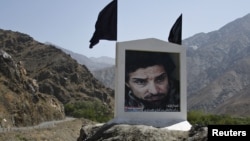 Slain national hero Ahmad Shah Masud, pictured here on a banner beside a mountain pass, is one of many top names mentioned in the report.