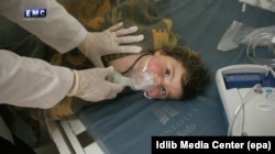 A child receives treatment at a field hospital after the alleged chemical attack in Syria.