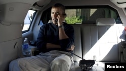 U.S. President Barack Obama speaks on the telephone with Afghan President Hamid Karzai to convey his shock over the shootings.