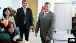 South Ossetian leader Eduard Kokoity addresses reporters at a polling station.