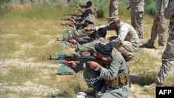 U.S. Marines conduct a training session for Afghan local police in Helmand Province. The United States and its NATO partners are racing against the clock to train Afghanistan's 350,000-strong security forces.