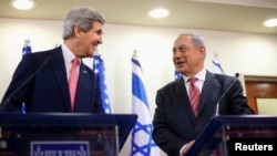 U.S. Secretary of State John Kerry (left) and Israeli Prime Minister Benjamin Netanyahu address a joint news conference in Jerusalem on December 5.