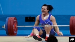 Svetlana Podobedova reacts after her final lift to win the gold medal in her group at the 2012 Summer Olympics in London.