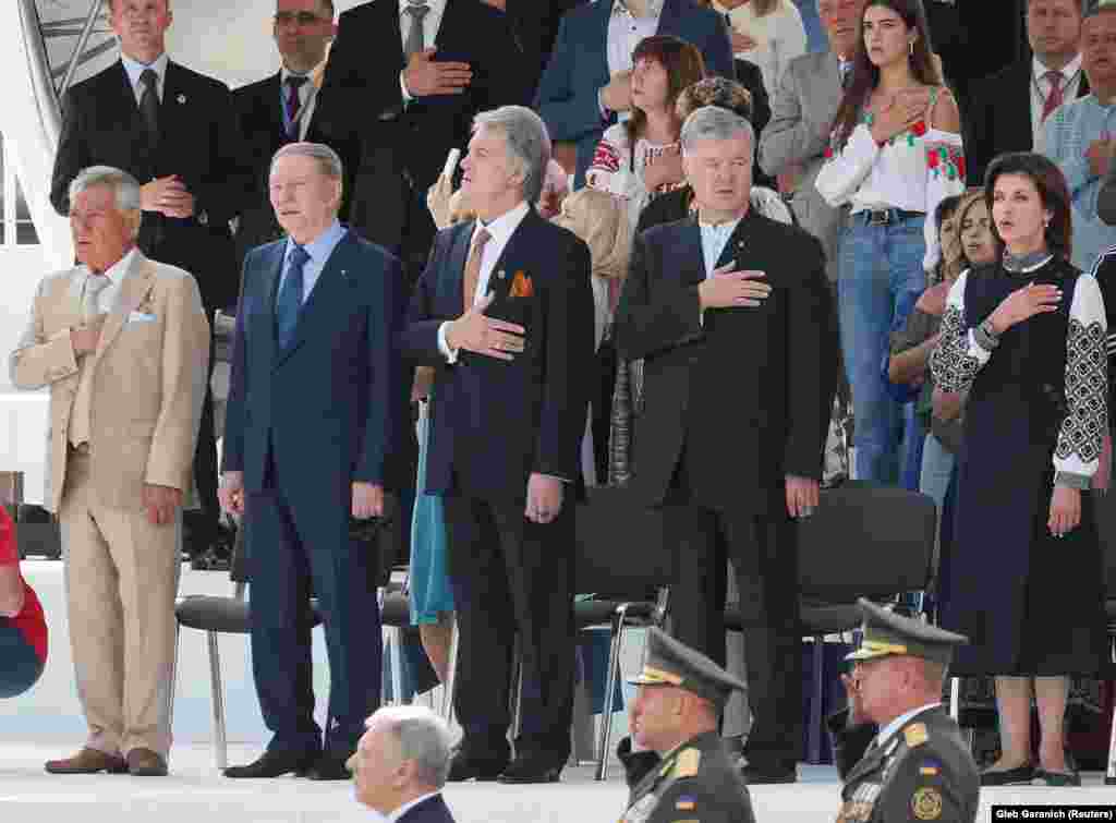 Former Ukrainian Presidents Petro Poroshenko (second right), Viktor Yushchenko (center), and Leonid Kuchma (second left) watch the Independence Day parade in Kyiv.