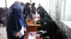 Women cast their votes in Kandahar during the flawed parliamentary elections in Afghanistan in October 2018. A lack of credible information about the biometric system could hamper their participation in the upcoming presidential election.