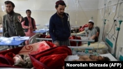 Afghan victims receive medical treatment at a hospital following a suicide attack on a private construction company in Jalalabad in March 2019.