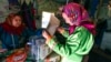 A woman casts her ballot at her home during early voting in the Tyumen region, over 2,000 kilometers northeast of Moscow.