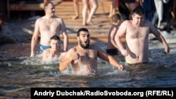 Ukrainians take part in Epiphany celebrations in Kyiv on January 19. 