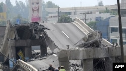 The rubble of a collpased bridge in the Chilean capital, Santiago