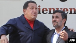 Iran's President Mahmud Ahmadinejad (right) greets his Venezuelan counterpart Hugo Chavez in Tehran.