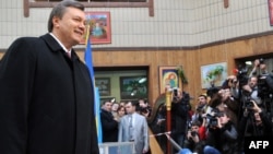 Presidential candidate Viktor Yanukovych answers journalits' question after casting his ballot at a polling station in Kyiv.