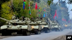 Azerbaijani forces move toward areas in Nagorno-Karabakh that have been handed back to Baku's control. 